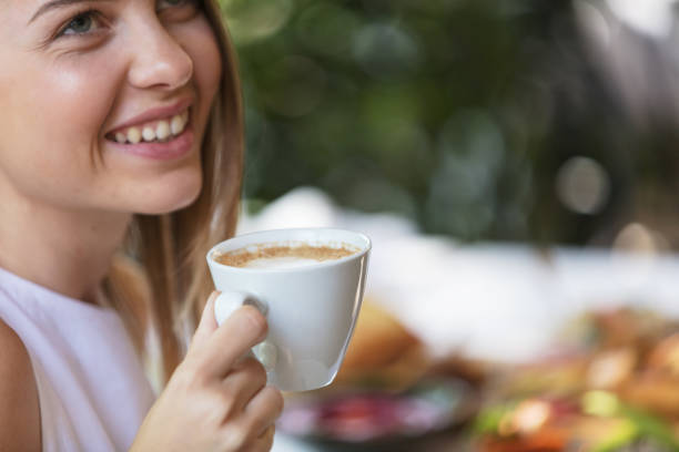 Woman enjoying coffee Smiling woman on coffee break 8564 stock pictures, royalty-free photos & images