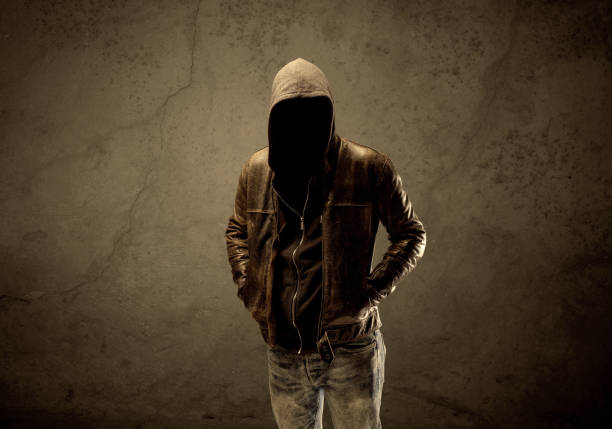 istock Undercover hooded stranger in the dark 907011812