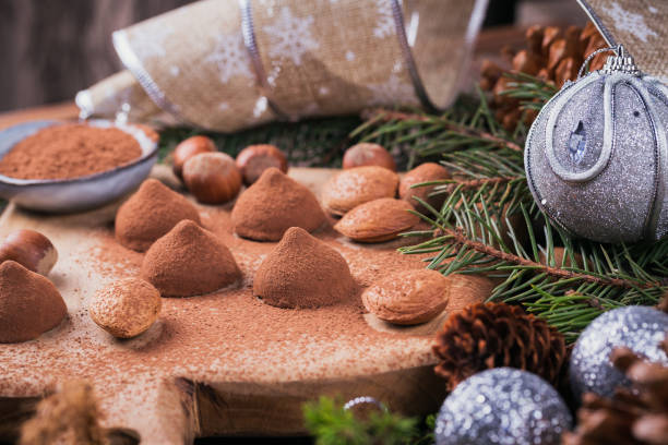 istock Homemade chocolate truffles, nuts, almonds and cocoa powder 907020188
