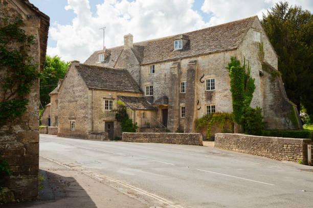 istock Old steet in  Bibury (Arlington Mill),  Gloucestershire,  England, UK. 907020654