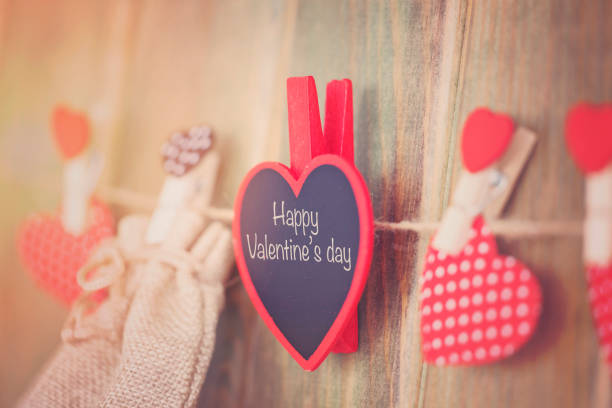 istock Happy valentines day message hanging on a rope. 907022578