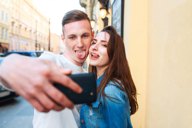 istock Tourists taking photo in the city 907047802