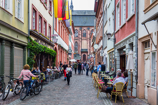 Heidelberg, Germany - May 6, 2017: Marketplace crowded with tourists and Town Hall in Heidelberg in Germany. Heidelberg is a city in Baden-Wurttemberg in Germany.