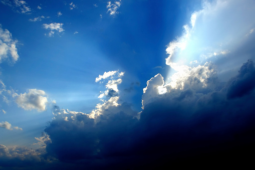 sunlight shining through clouds and blue sky background, panoramic angle view