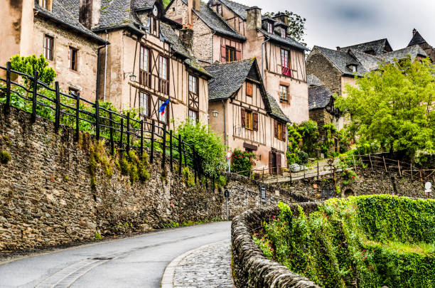 Street on the way up in the beautiful village of Conques stock photo
