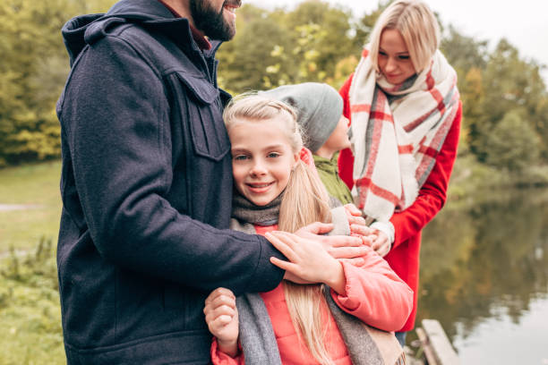 istock family in autumn park 907083732