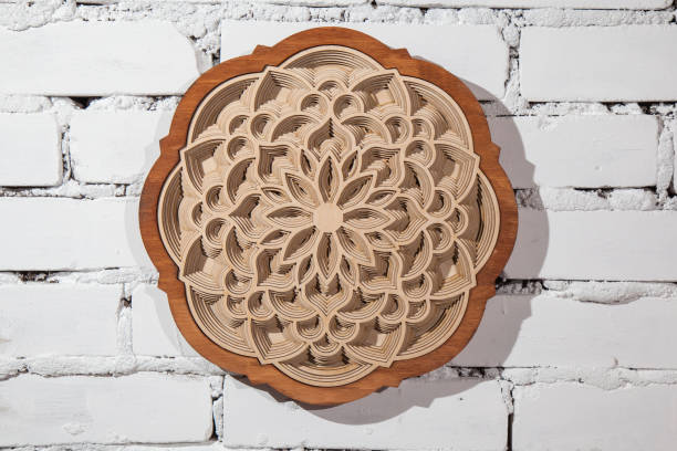 istock The layers of the mandala are cut from a tree by a laser 907085908