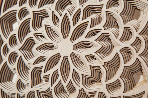 istock The layers of the mandala are cut from a tree by a laser 907086308