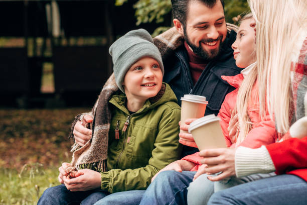 istock family with paper cups in park 907096678