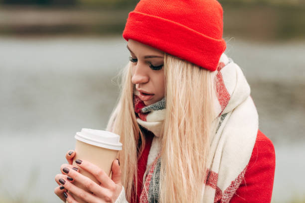 istock girl with coffee to go 907101938