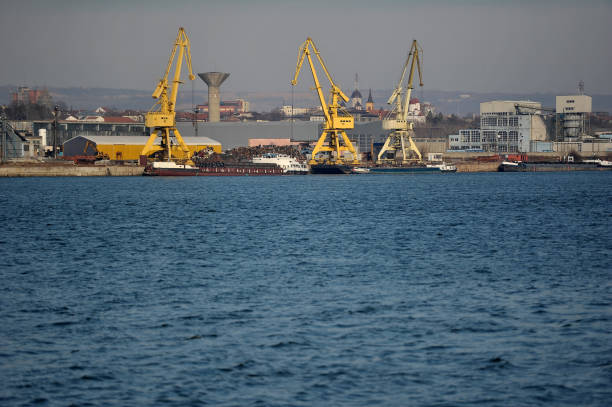 istock Port crane on sunny day 907105134