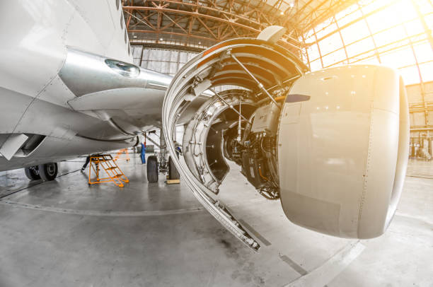 istock Aircraft service, view of the open engine hood. 907114024