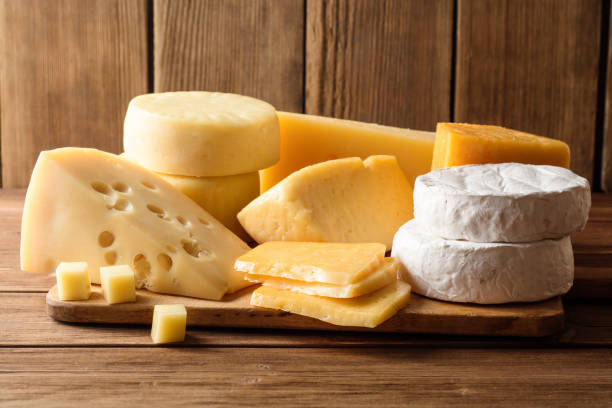 istock Various types of cheese on dark rustic wooden background. 907120814
