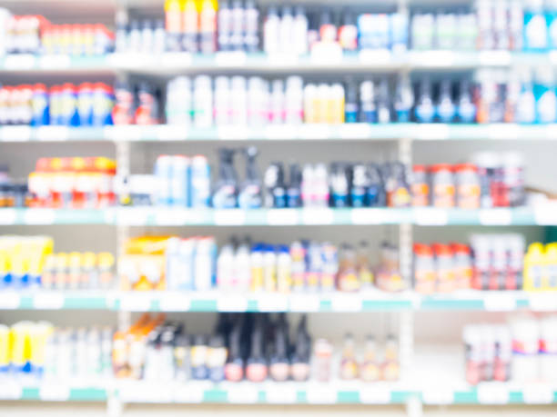 istock Abstract blurred supermarket aisle with colorful shelves 907133604