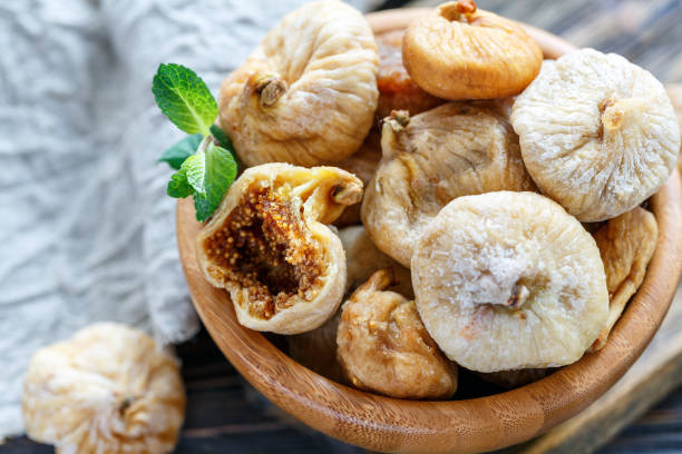 istock Dried figs in a bowl closeup. 907146222