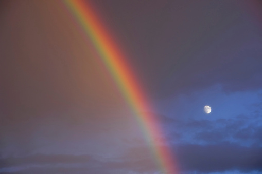 nature scenery: abstract rainbow and moonrise clouds, albuquerque, new mexico, usa, horizontal