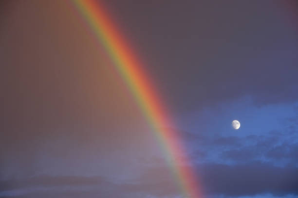 rainbow sky and moon stock photo