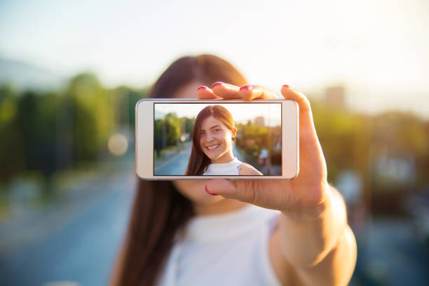 istock Young woman taking a selfie 907149266