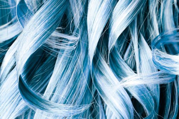 Blue curly hair full frame background.