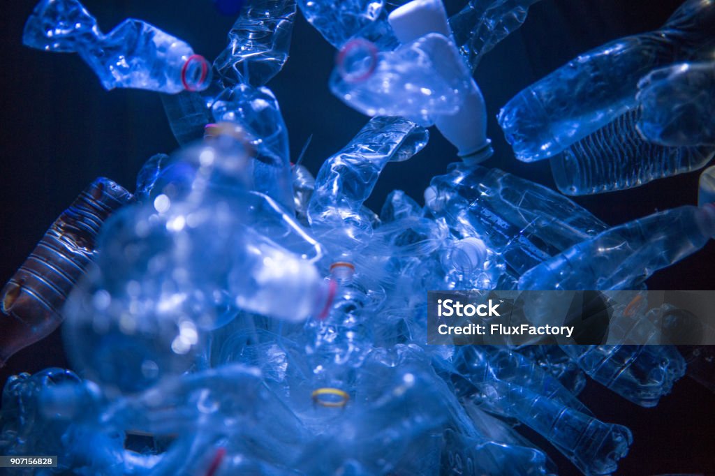 No clear waters here Plastic bottles floating in the sea, making it polluted. Plastic Stock Photo