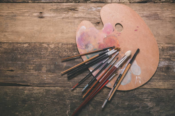 Painting background Paintbrushes and palette on wooden table art class photos stock pictures, royalty-free photos & images