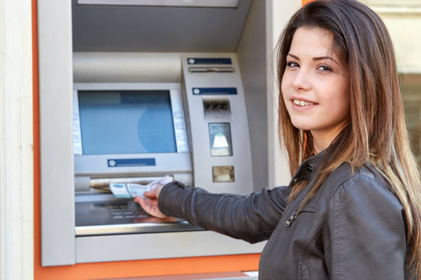istock woman take out forint banknotes from atm 907179926