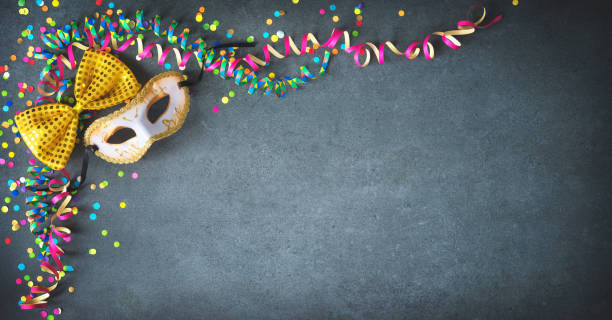 istock Masquerade decorations with streamers and confetti 907182464