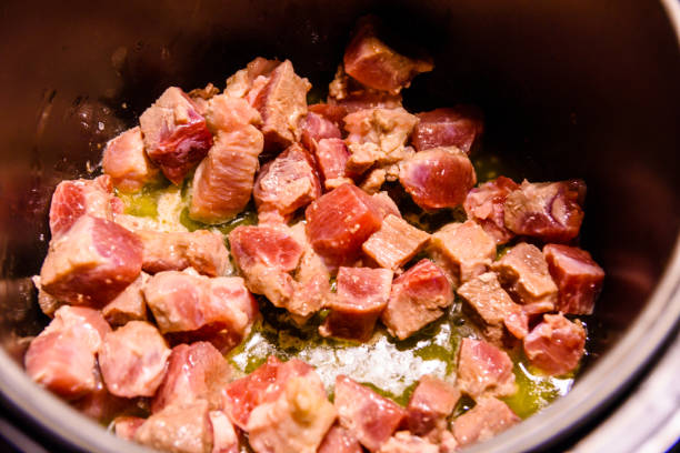 istock Pork meat preparing in a slow cooker 907191454