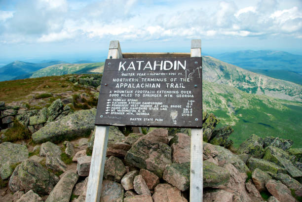 Mount Katahdin, Appalachian Trail Sign Baxter State Park, Maine, USA – August 1, 2011: Trail Sign for the Summit of Mount Katahdin and the Northern Terminus of the Appalachian Trail mt katahdin stock pictures, royalty-free photos & images