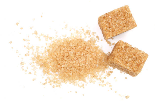 istock brown sugar isolated on white background. Top view. Flat lay 907206146