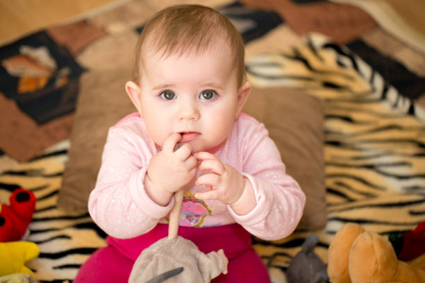 istock cute infant baby girl 907206748