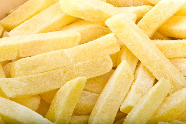 group of frozen chips group of frozen chips ready to be fried frozen food stock pictures, royalty-free photos & images