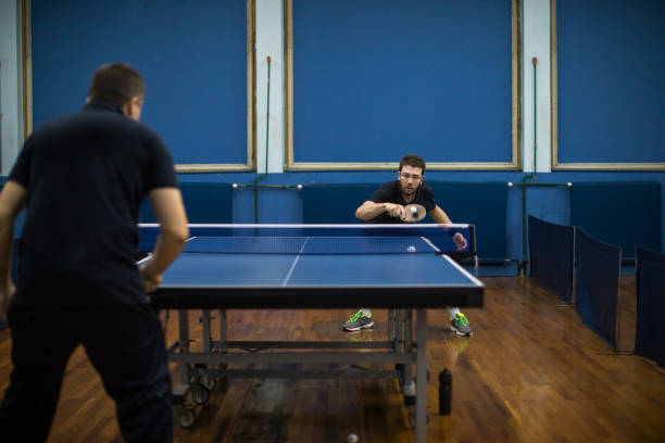 istock Two men playing Table tennis  indoors 907214240