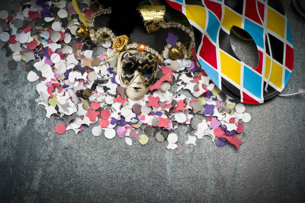 istock Carnival mask on colorful confetti 907216130