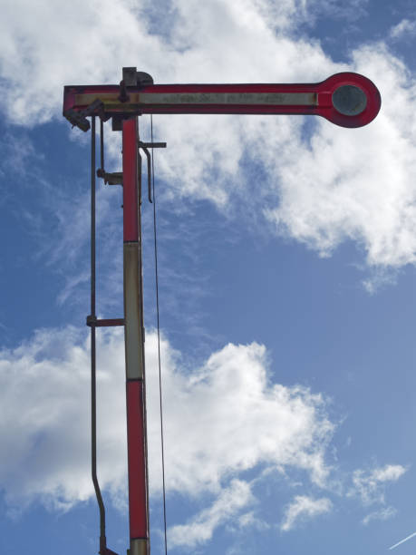 istock old railroad sign and bright clouds in the background 907226268