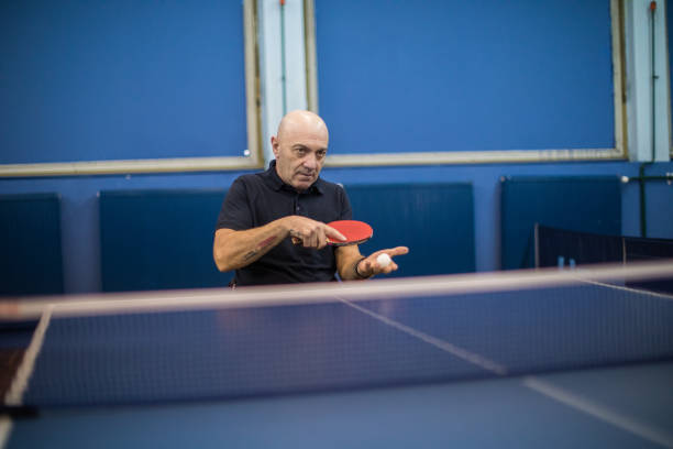 istock Mature disabled man playing table tennis 907247668