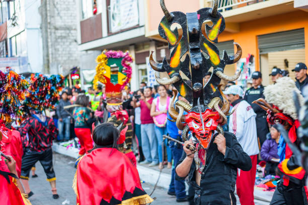 Píllaro, ECUADOR - FEBRUARY 6, 2016: Unknown locals dressed up participating in the Diablada, popular town celebrations with people dressed as devils dancing in the streets
