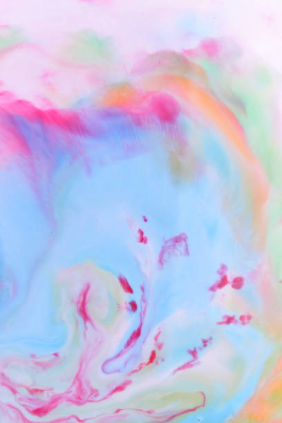 istock Multicolored abstract background on liquid, multicolored minimalistic background, pop art pattern, pastel texture for designer, background preparation, color divorce on milk 907262234