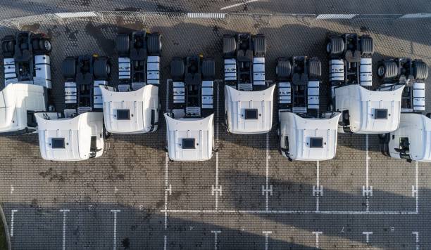 istock Aerial drone view of parked white trucks 907267136