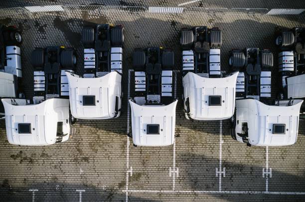 istock Aerial drone view of parked white trucks 907267498