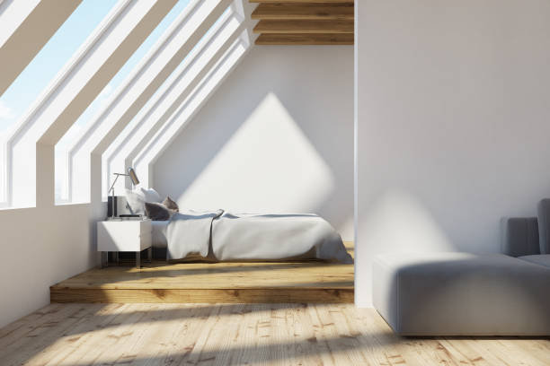 istock White attic bedroom, wooden ceiling 907284100