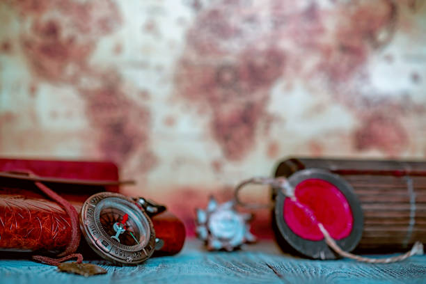 istock Retro compass and vintage map on the background 907313492