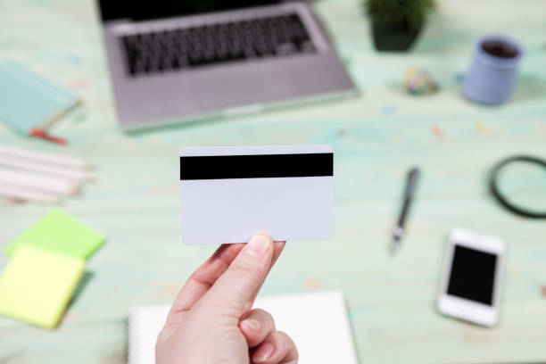 istock A man is going to pay for the goods in the internet using credit card and laptop computer. 907317834