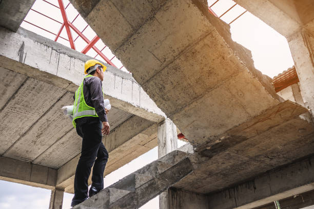 istock professional engineer worker at the house building construction site 907337870