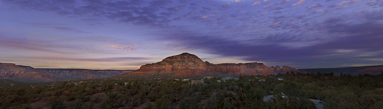 a landscaped view of the Sedona mountains and sunset washed sky