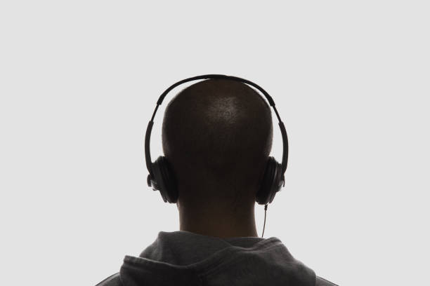 male silhouette with headphones - rear view back human head men imagens e fotografias de stock