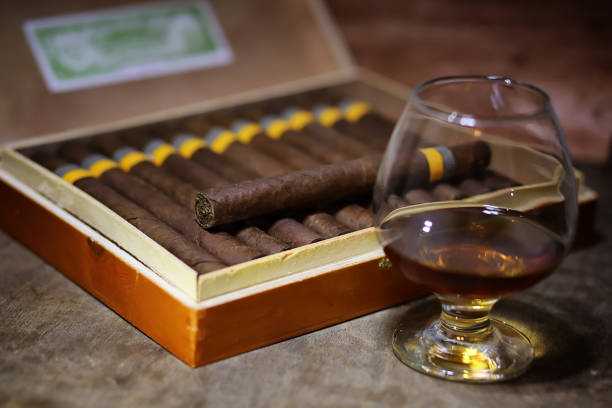 istock Large box of Cuban cigars on a wooden table 907354834