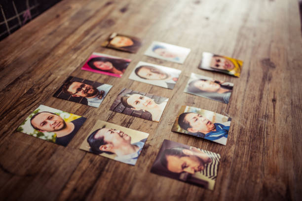 istock Profile pictures on a wooden desk 907355214