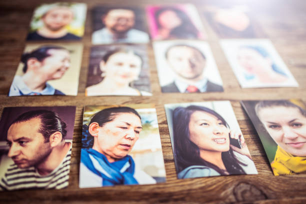 istock Profile pictures on a wooden desk 907359428