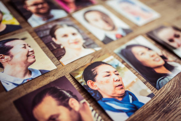 istock Profile pictures on a wooden desk 907365634